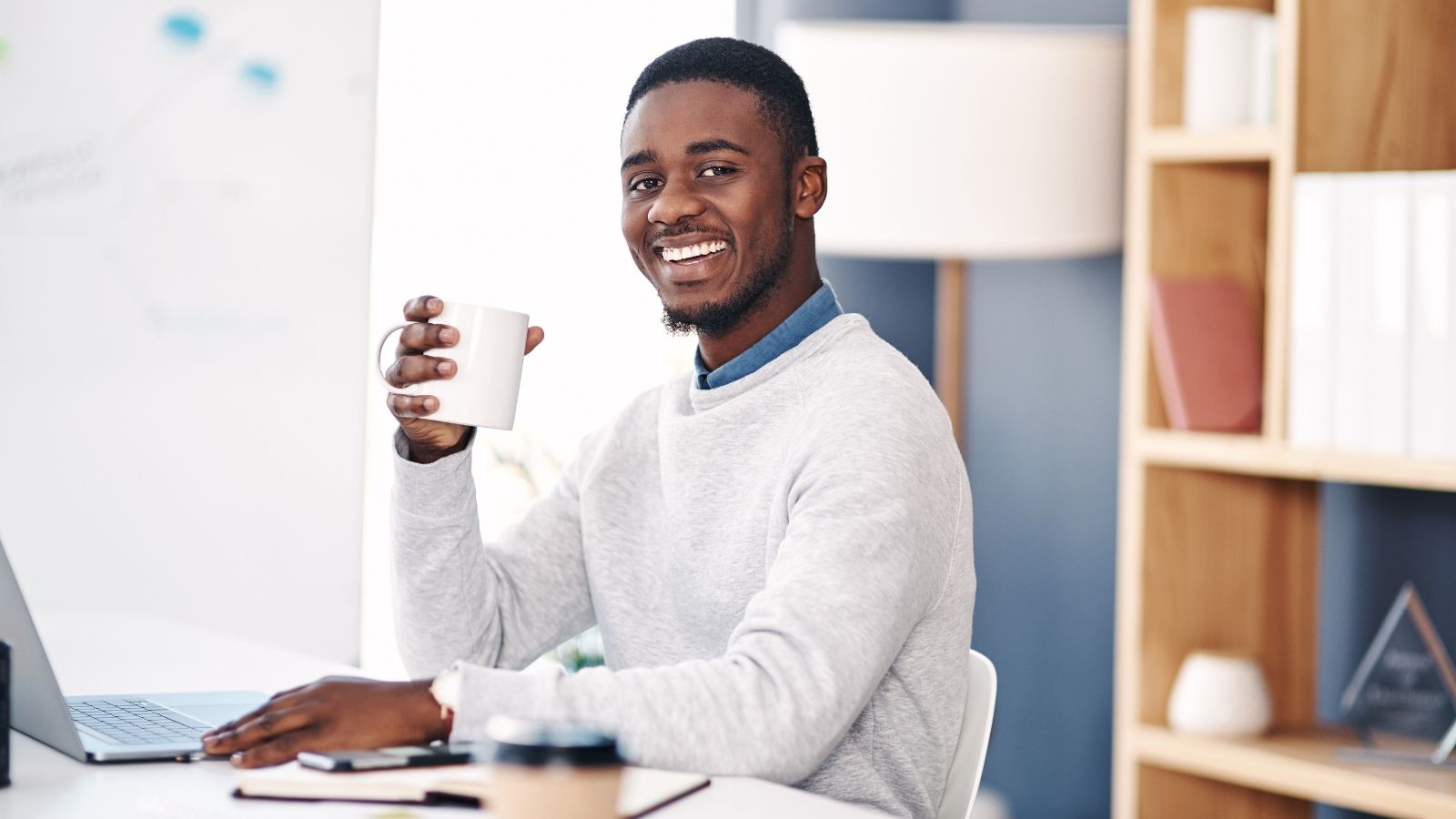 His Boss Reprimanded Him for Leaving Early — So He Started Claiming More Overtime Than Ever smiling man in an office