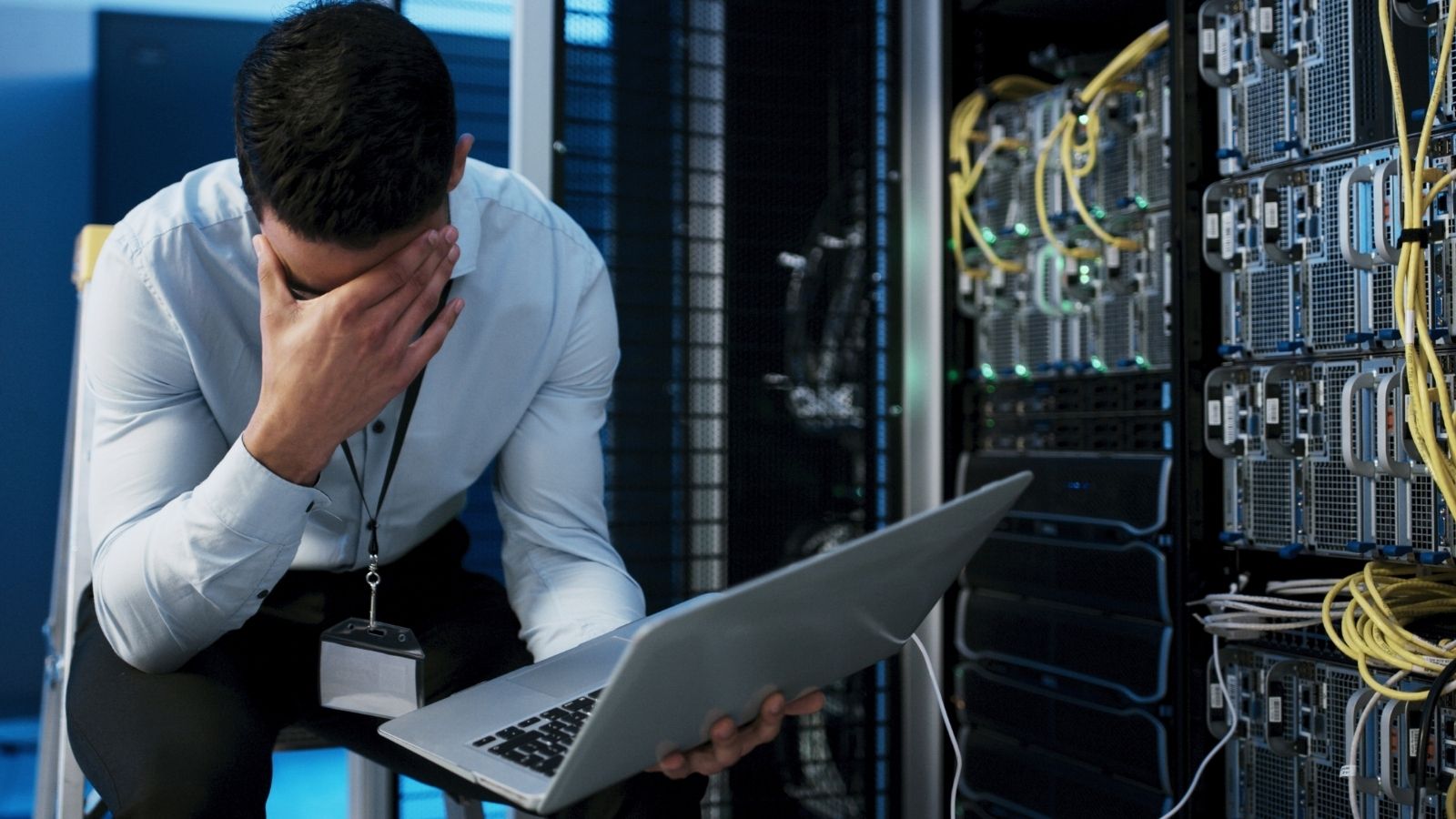 A Tech Worker Had To Fix A Huge Security Flaw, But Finding The Answer Took Way More Than Expected frustrated man in a server room