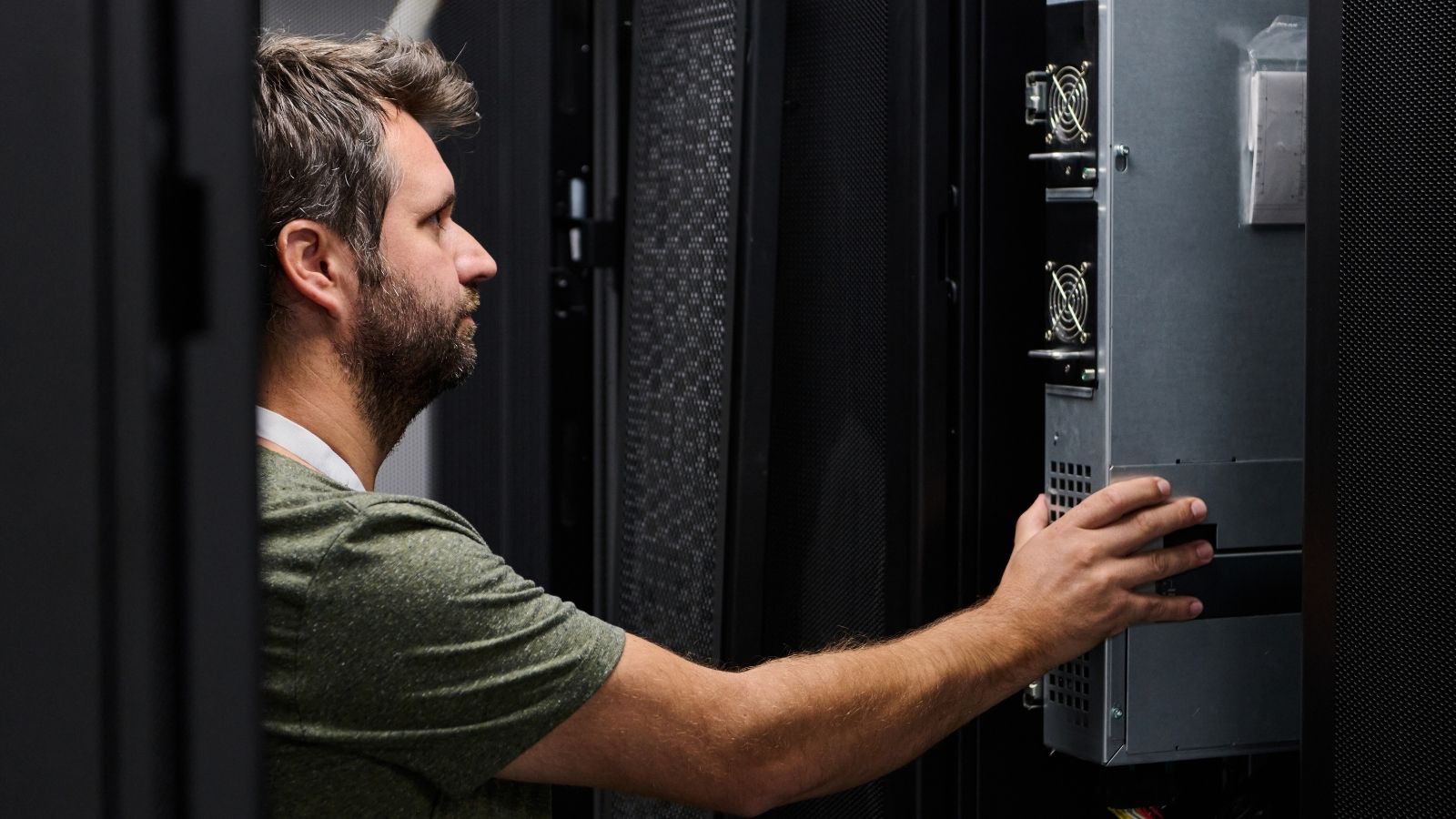 His Lead Technician Couldnt Figure Out Why a Servers OS Wouldnt Load — So He Called a Friend for Help man inspecting server