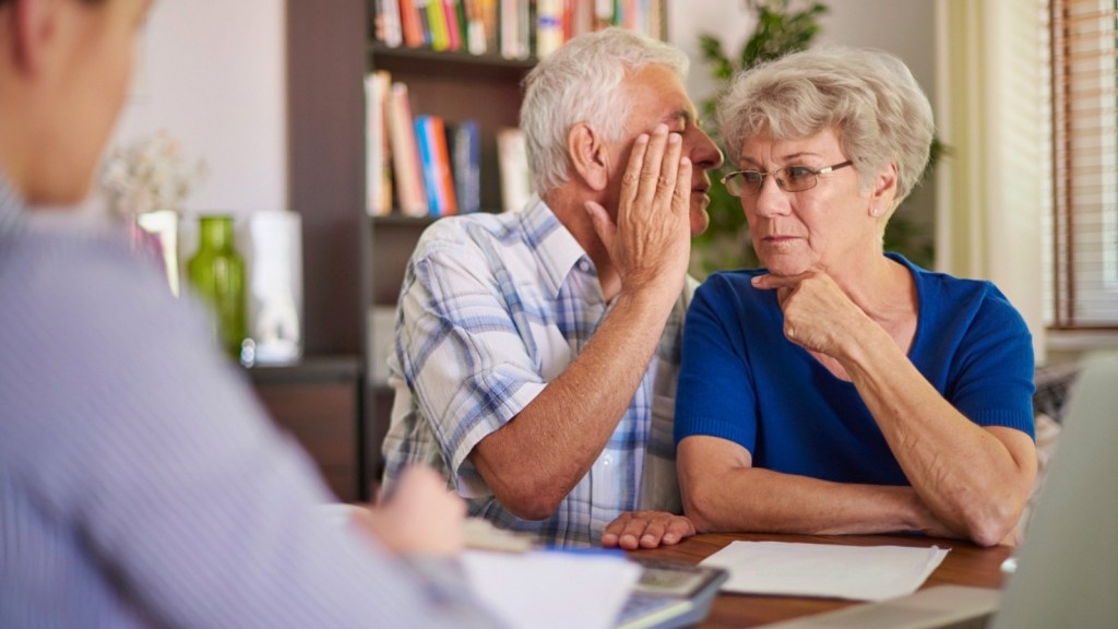 Elderly couple whispering