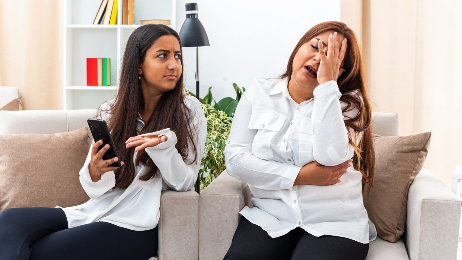 Two women arguing indoors