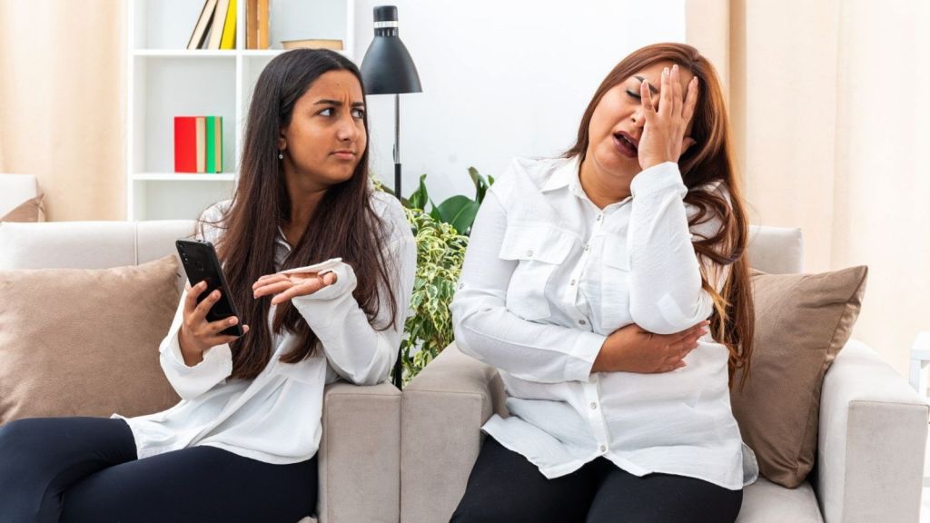 Two women arguing indoors
