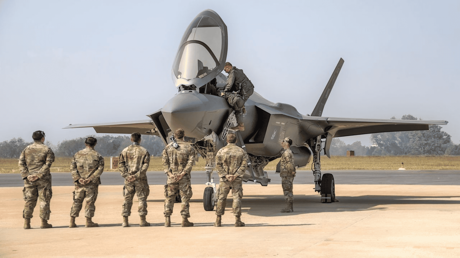 A Junior Airman Overstepped With A Superior — His Payback Was A Very Strange Treasure Hunt Airmen looking at fighter jet