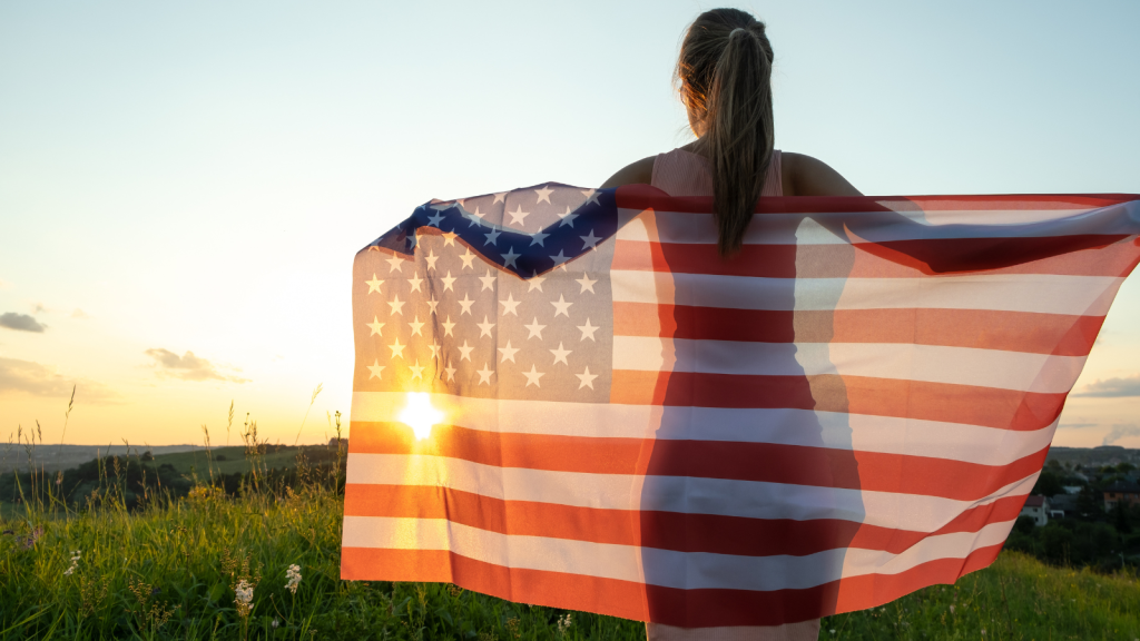 Woman with USA flag outside