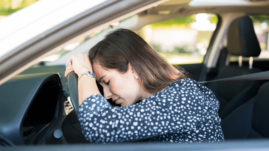 annoyed woman driving a car