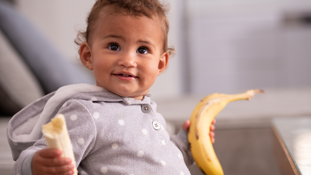 One Brother Found Himself In A Family Argument Over Snacks, And His Candid Response To His Sister Only Made The Moment More Tense baby holding bananas
