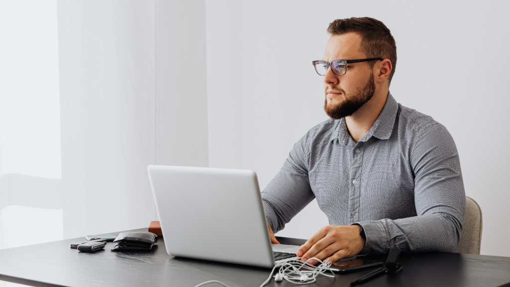 He Tried To Save The Client Money — Instead, He Ended Up Paying Out Of Pocket For His Own Ride Home businessman looking at a laptop computer
