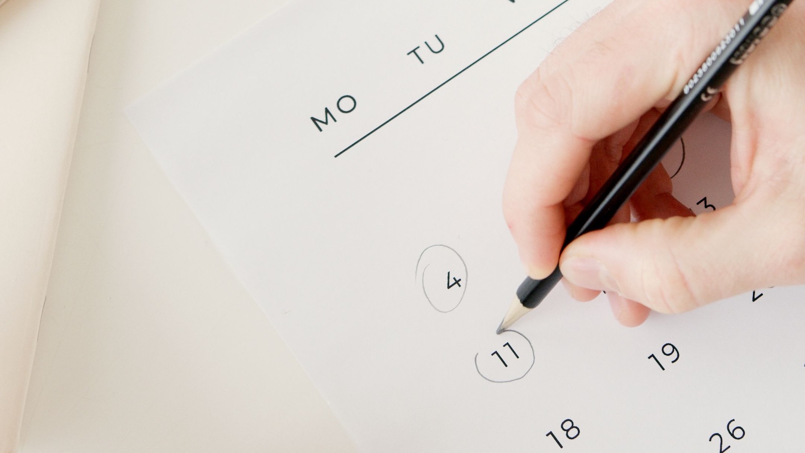Their Babys Dedication Was Approved For A Weekday — Grandma Had Other Plans And Started Making Calls person circling a date on a calendar with a pen