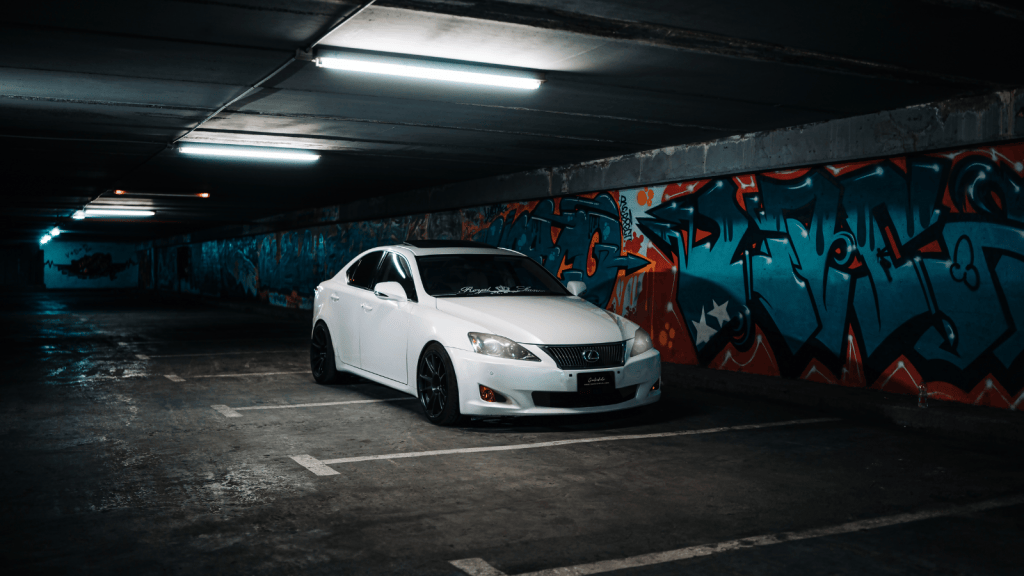 She Was Tired Of Paying A Workplace Parking Fee, So She Turned It Into A Problem To Solve — And Found A Way To Stop Paying It car parked in a dark underground parking