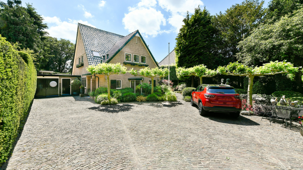 car parked in home's large driveway
