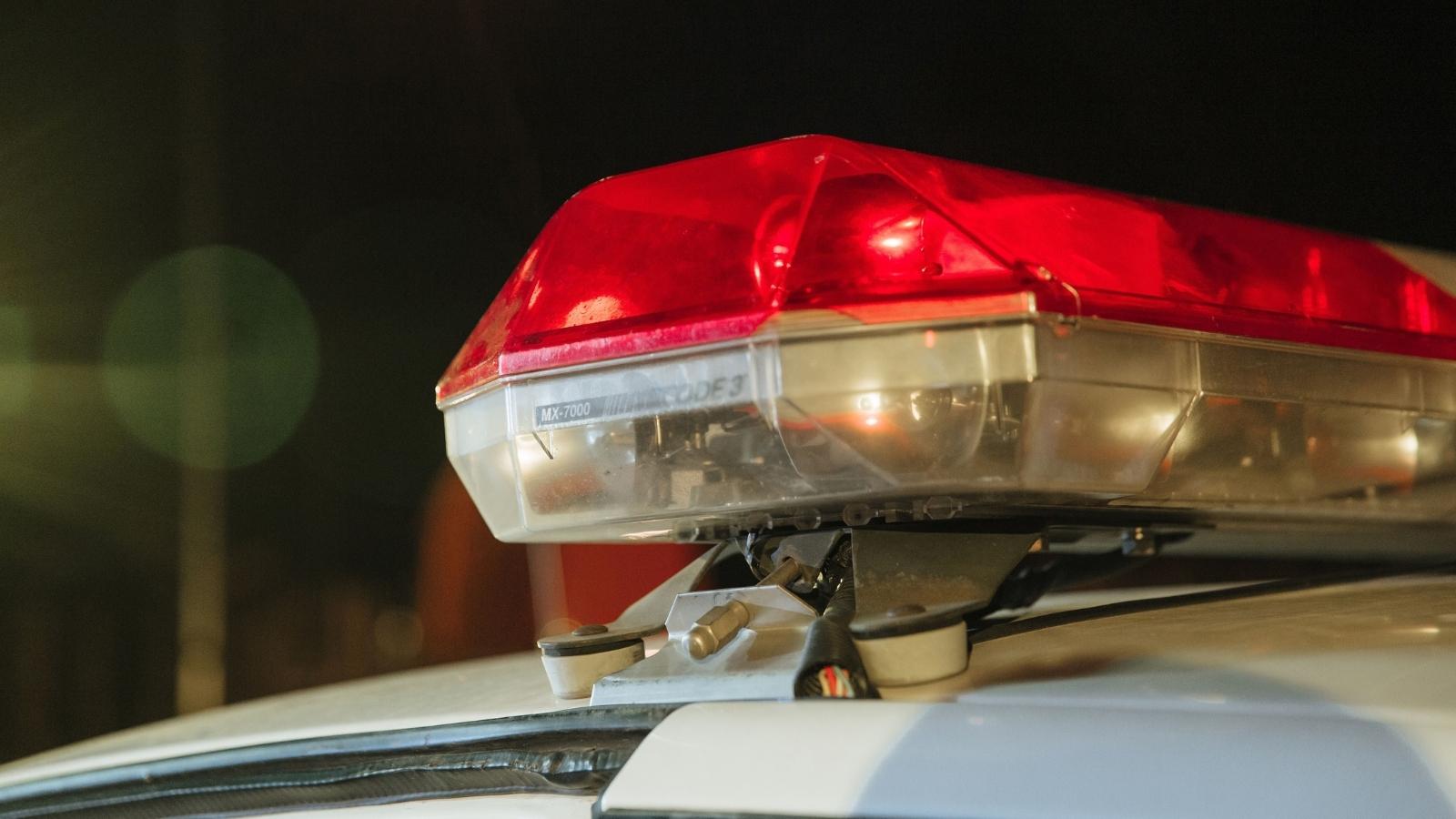 His Yard Signs Were Smashed and His Tires Slashed at 2:00 AM—Then He Turned Over 4K Night Vision Footage to the Police closeup of police lights