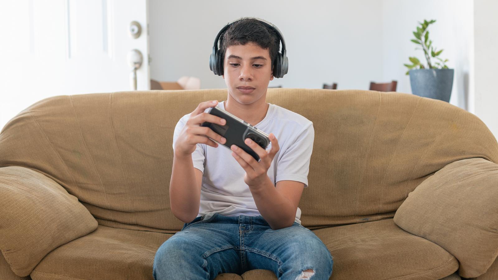 He Found Out His Young Cousin Was Playing Grand Theft Auto — So His Aunt Shut It Down and Took His Xbox boy playing a video game