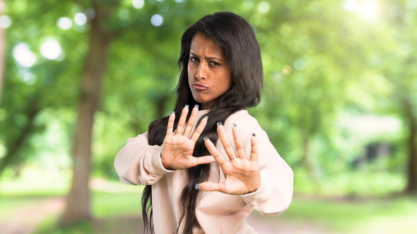 Womans Neighbors Keep Making Noise And Letting Their Dog Use Her Yard, But Talking To Them Hasnt Helped woman throwing up her hands