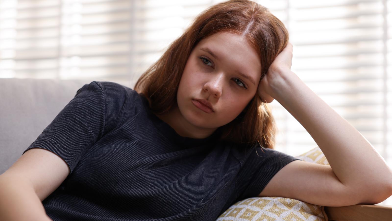 young woman with a serious expression