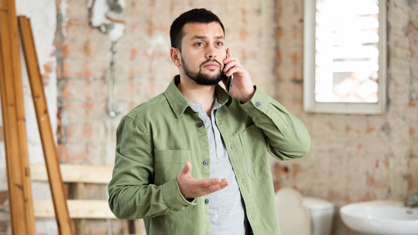 A Landlord Lied About Why People Were Inspecting A Mans Apartment, So He Used The Opportunity To Expose Everything Wrong With It man on a phone call
