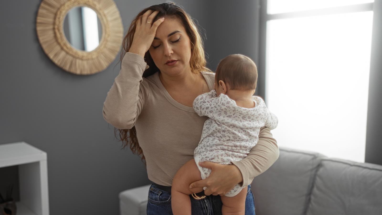 She Was Running on Empty Every Morning with Their Baby—Now Shes Demanding Her Husband Step Up or Face the Consequences woman holding a baby
