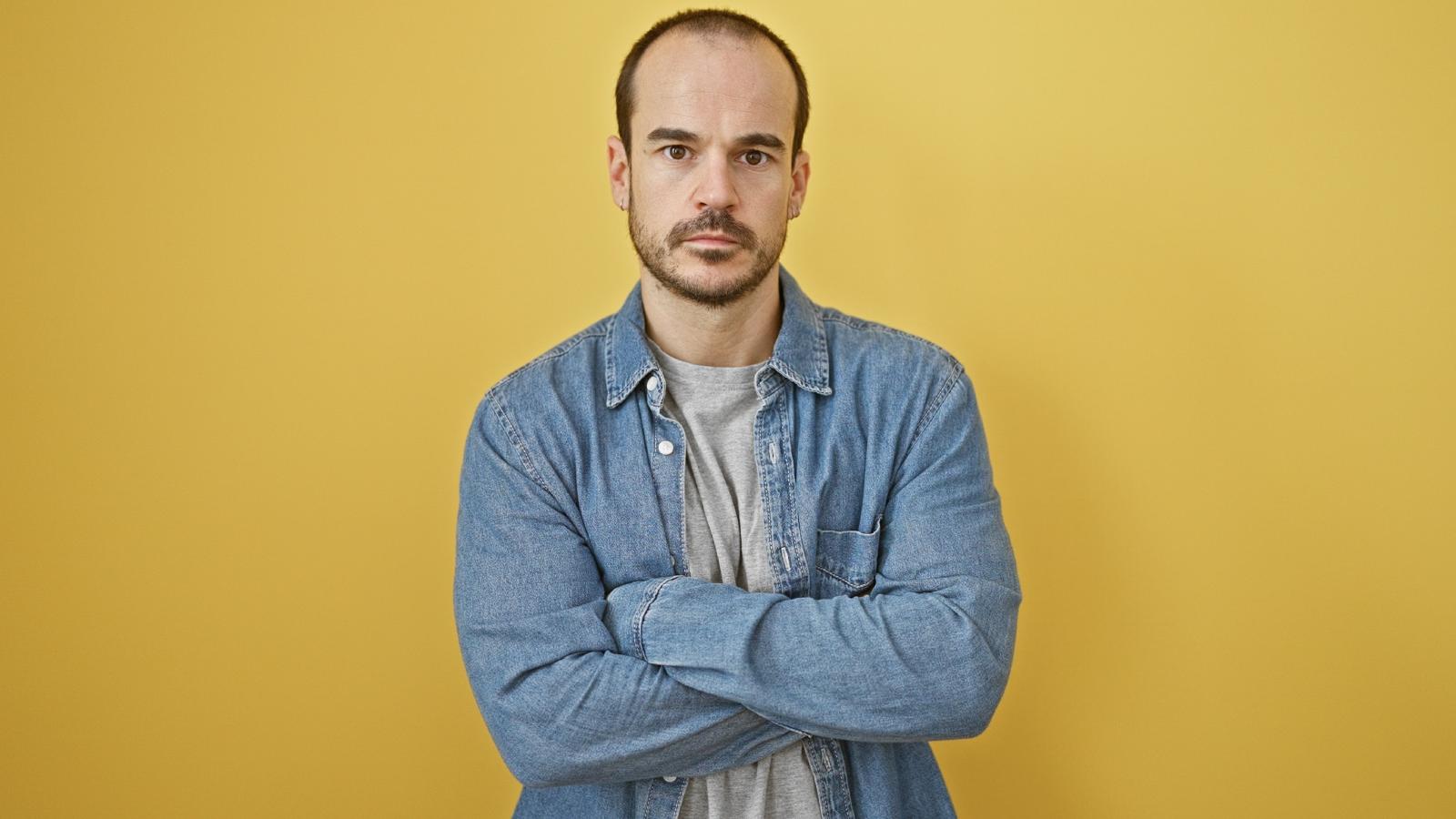 man with his arms crossed