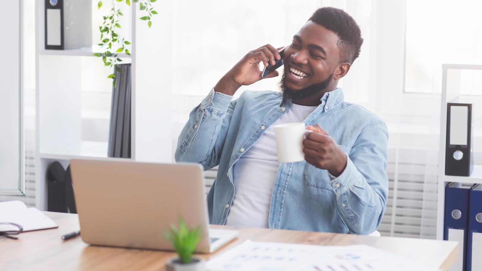 Office Workers Were Forced To Use A New Phone System, So They Chose Hilarious Hold Music For Callers man on a phone call in an office