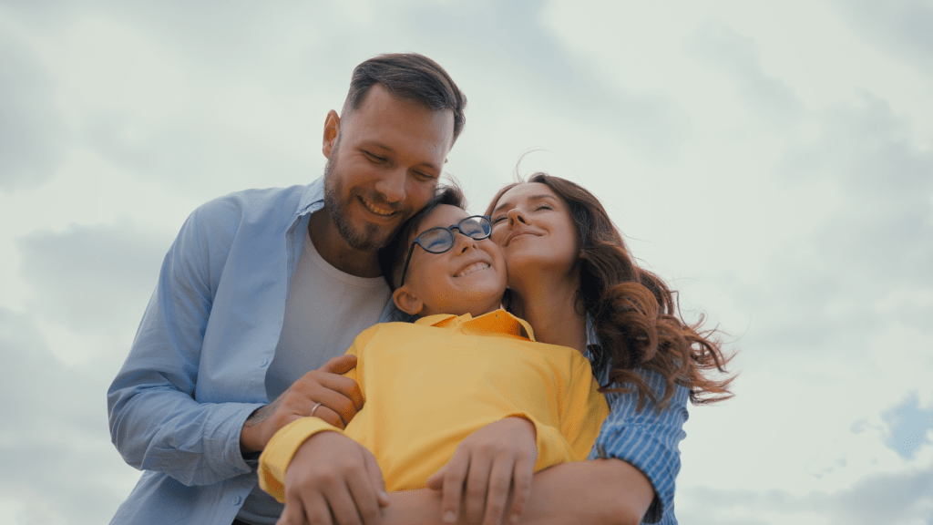 couple smiling with adopted son