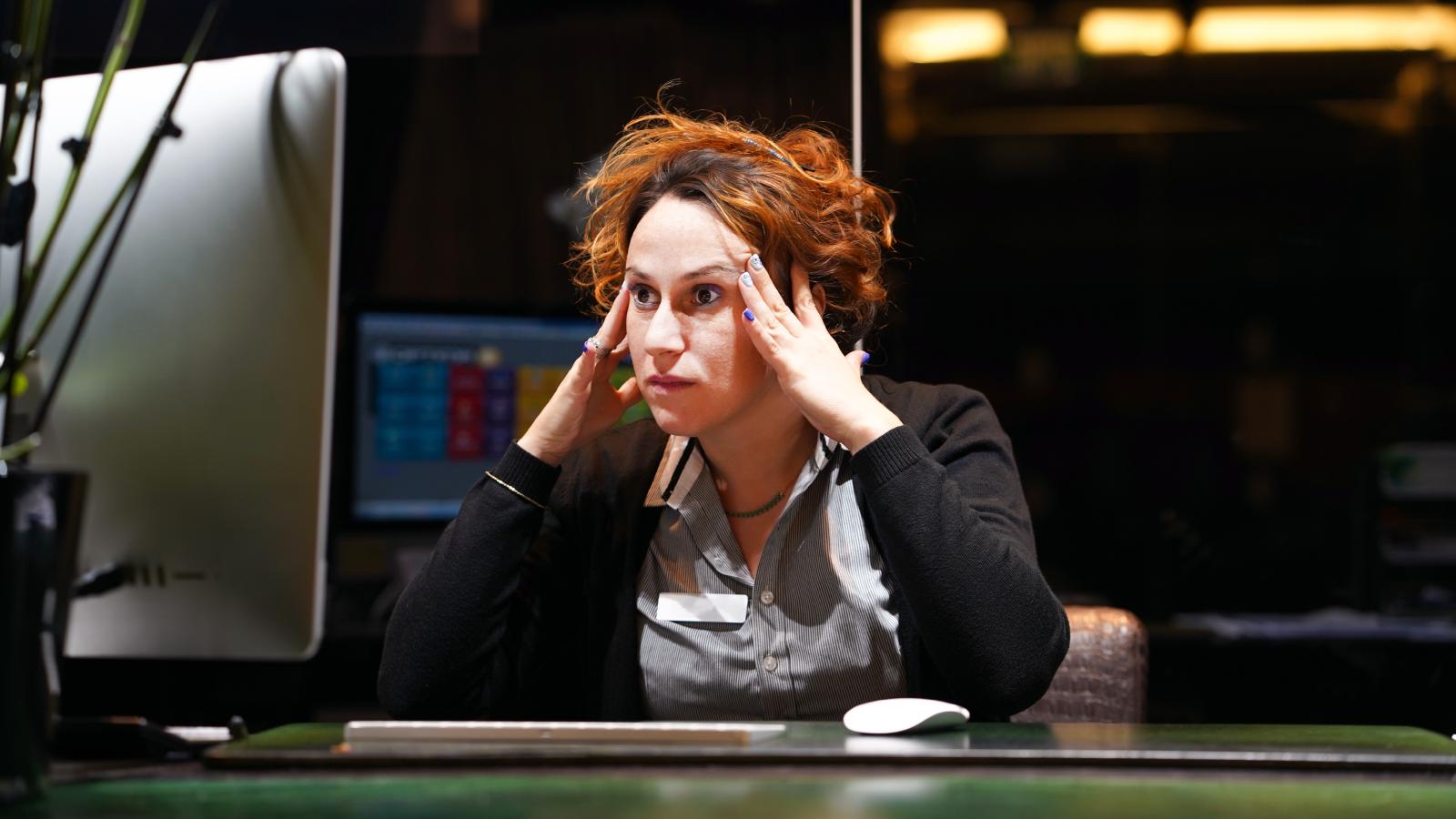 Hotel Worker Is Furious After New Management Starts Using AI Images To Mock And Criticize The Staff woman staring at a computer