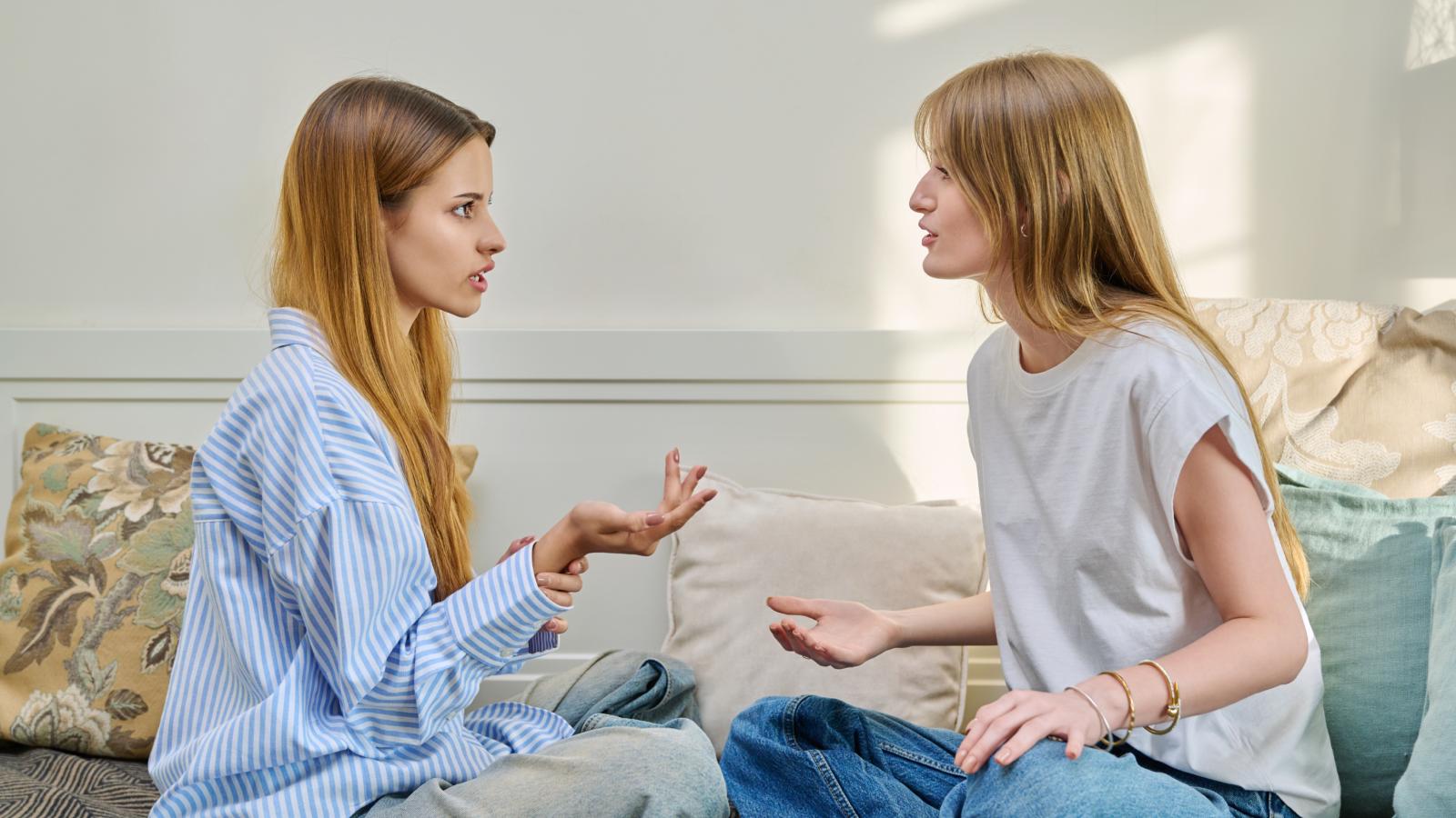 A Stranger Moved Into Her Apartment Days Early and Stole the Best Bedroom Before She Even Arrived—Now She’s Demanding It Back two young women having a talk
