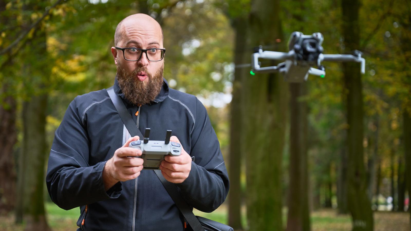 man operating a drone