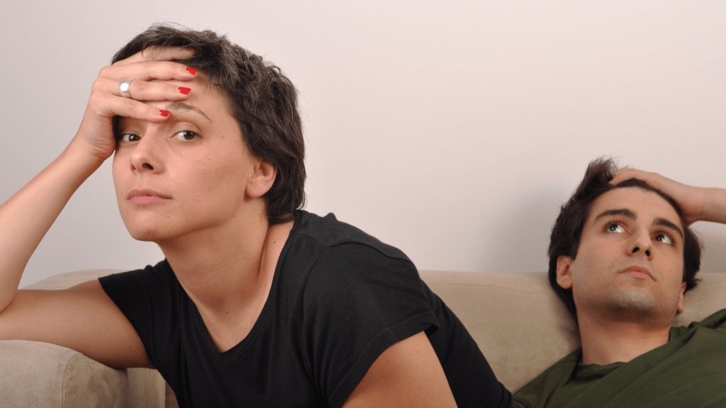 exasperated brother and sister argument on couch