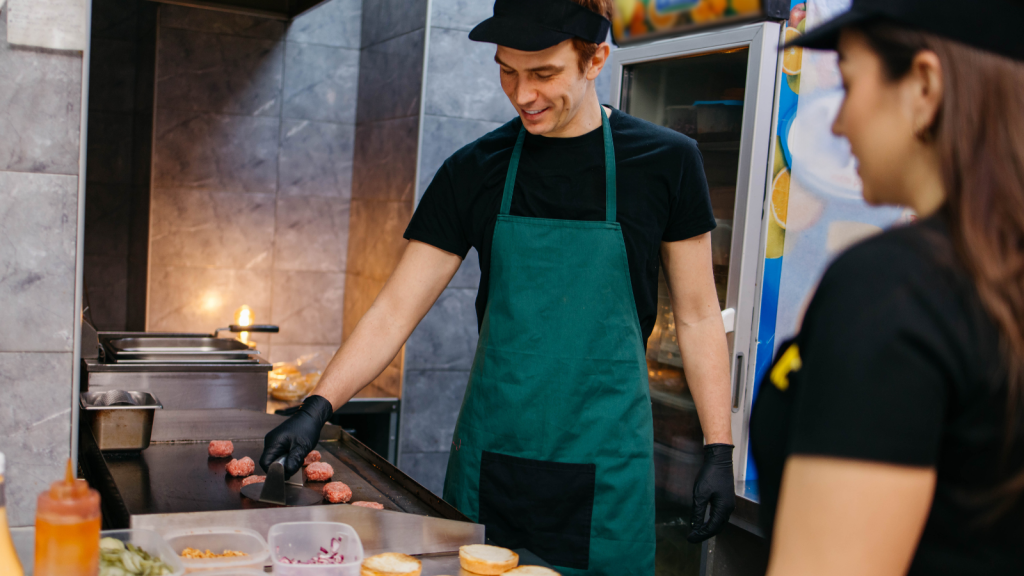 fast food employees working in kitchen