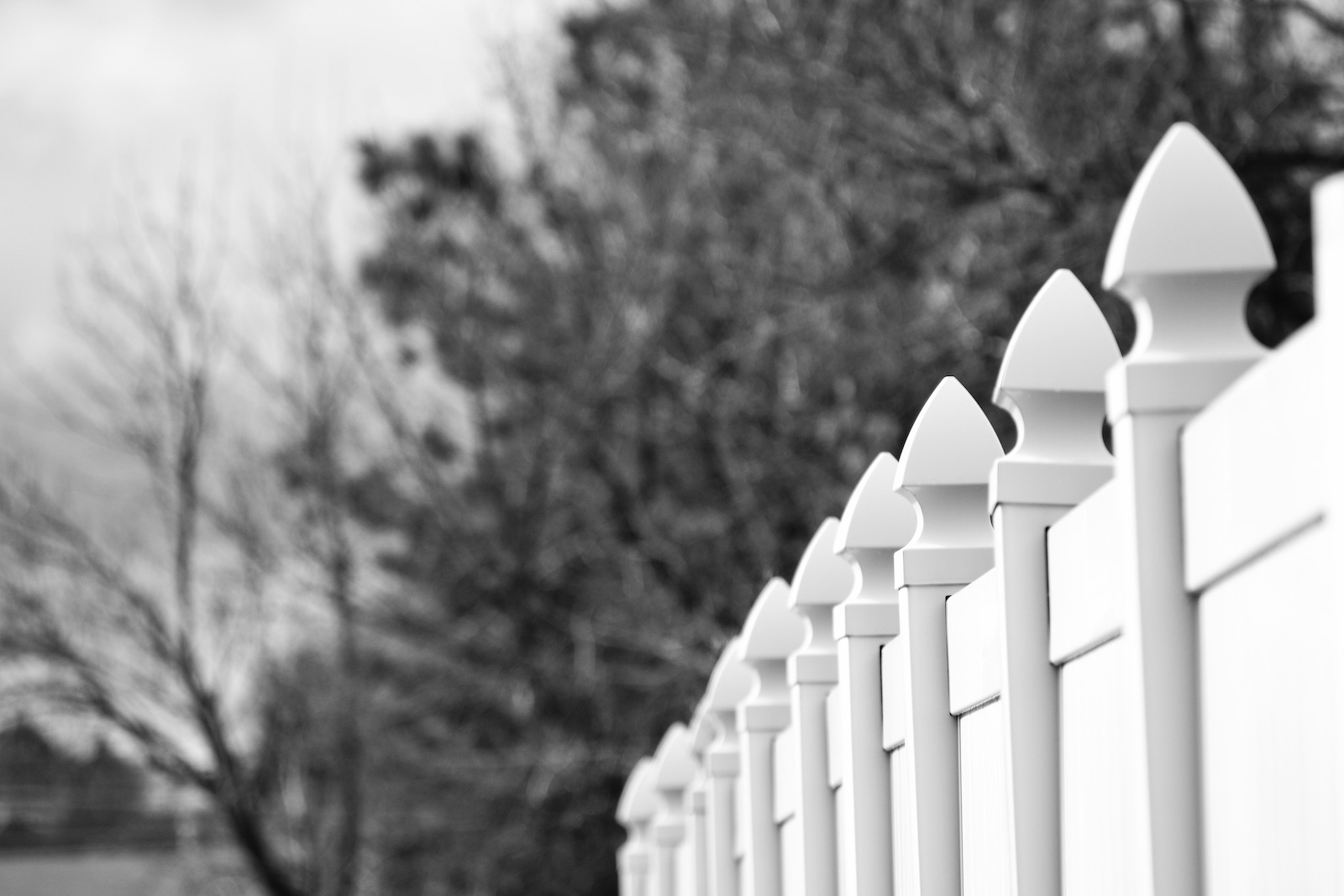 white picket fence against wall