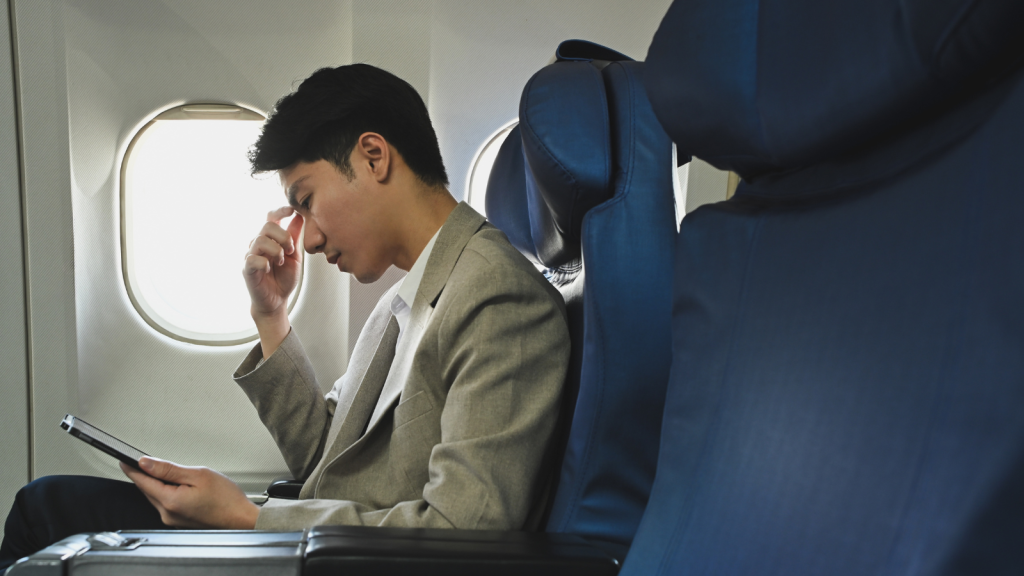 One Worker Turned A New Boss’s Demand To Use Personal Travel Rewards Against The Company By Spending The Miles On His Own Trips First frustrated businessman sitting on plane looking at phone
