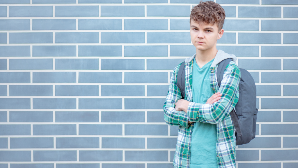 His Family Grew by Several Kids Overnight — So He Chose to Move Out and Live With His Dad frustrated teen boy wearing a backpack