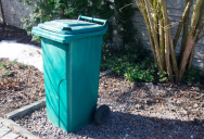 He Got Fed Up With Garbage Bins Blocking His Driveway — So He Kicked Them Back Onto Her Property