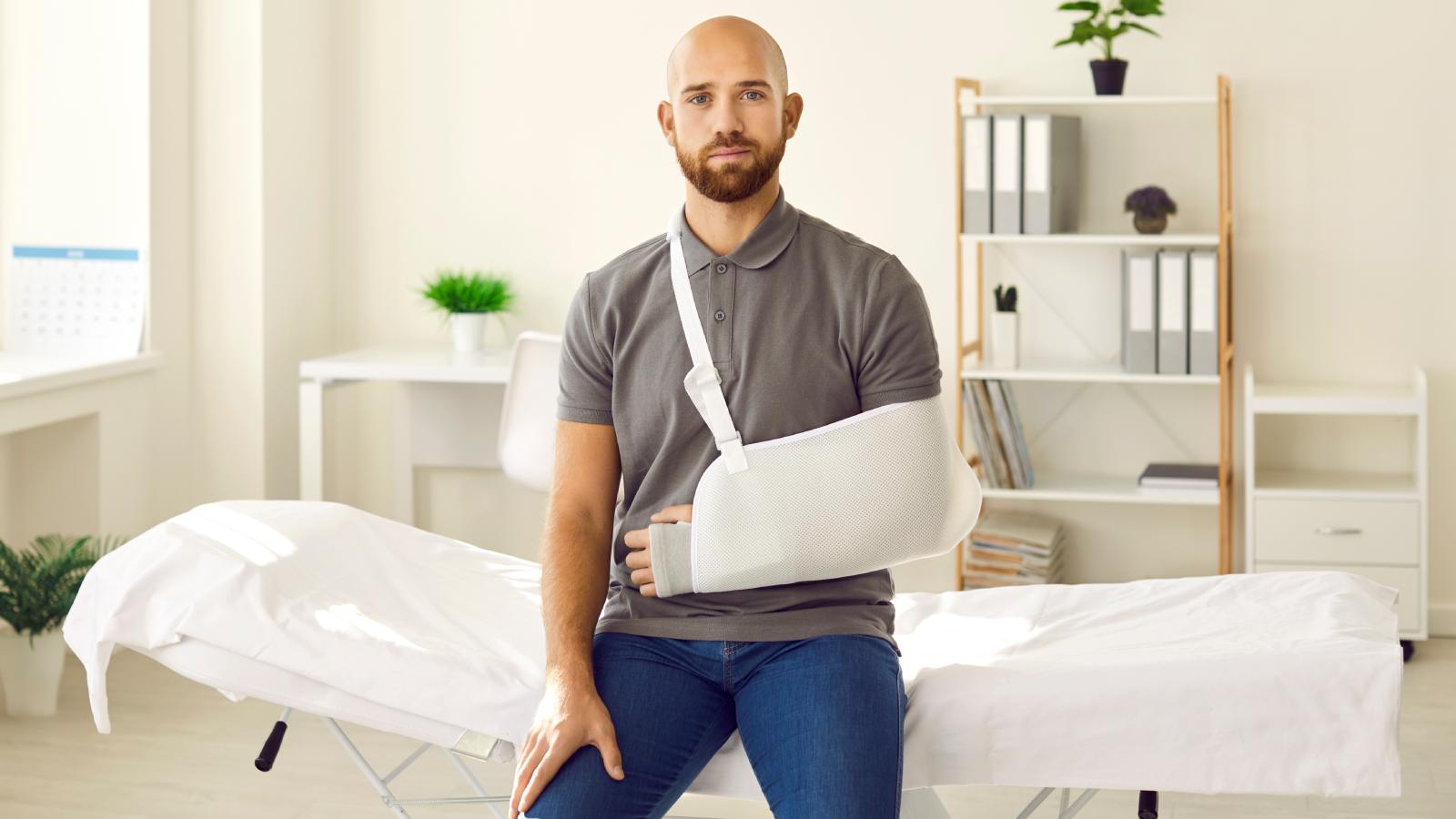 man with his arm in a sling