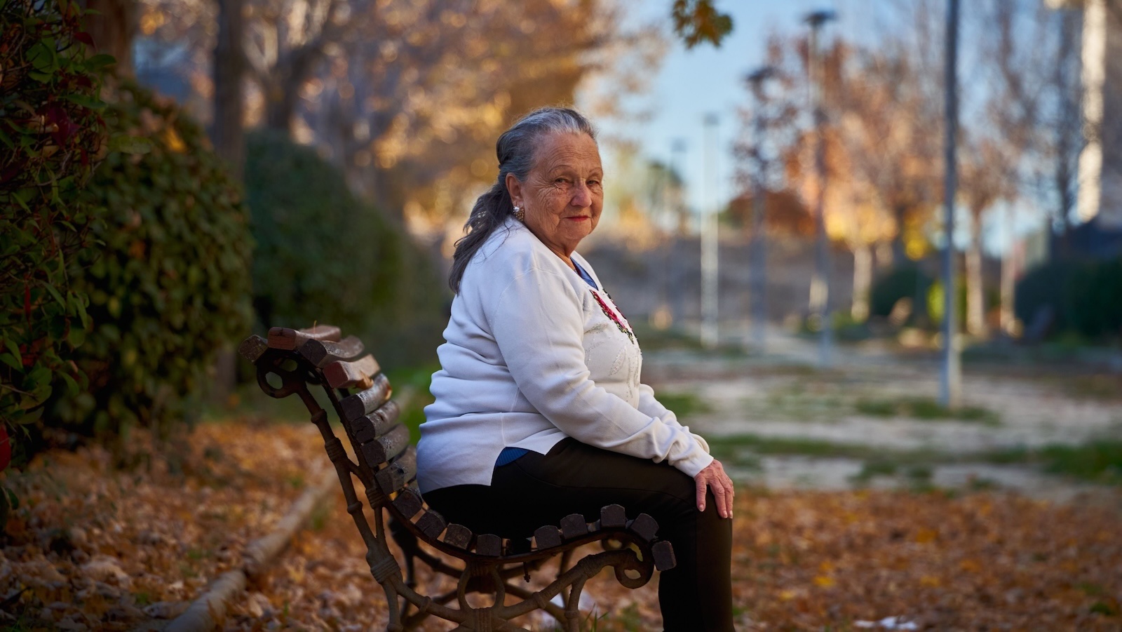 She Let Her Mom Live Rent Free for 2 Years — Then Overheard What Shes Been Telling the Family woman sitting on bench outside