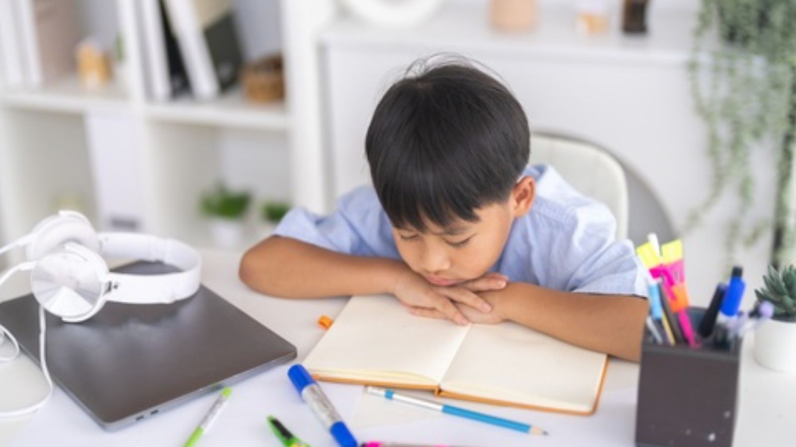 Lazy kid studying