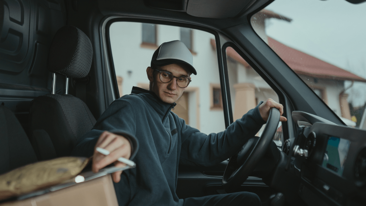 Employee Was Denied Company Help Getting His Commercial Drivers License, So He Used Paid Overtime To Take The Test man driving a truck grabbing clipboard