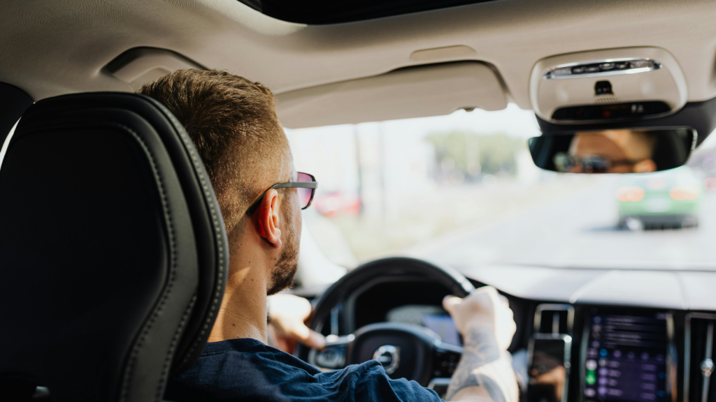 His Family Has Always Shared Rides To Cut Costs, But His Future Wife Thinks It’s Time To Stop Relying On The Same Routine man driving in car with sunglasses