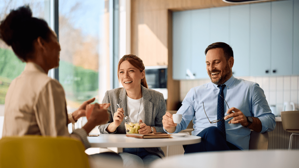 A Manager Twisted an Innocent Comment Into Huge Drama—and Exposed His Controlling Nature to His Colleagues man laughing in break room at the office