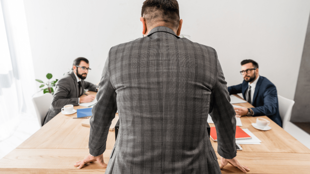 man looking across the table at a meeting