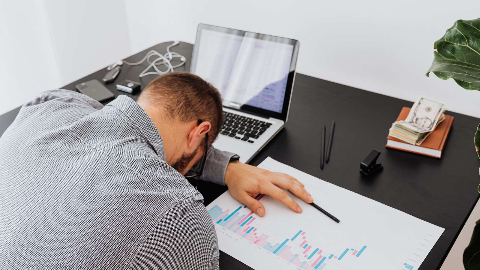 man looking stressed paying bills