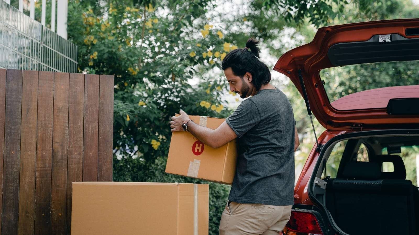 man moving boxes
