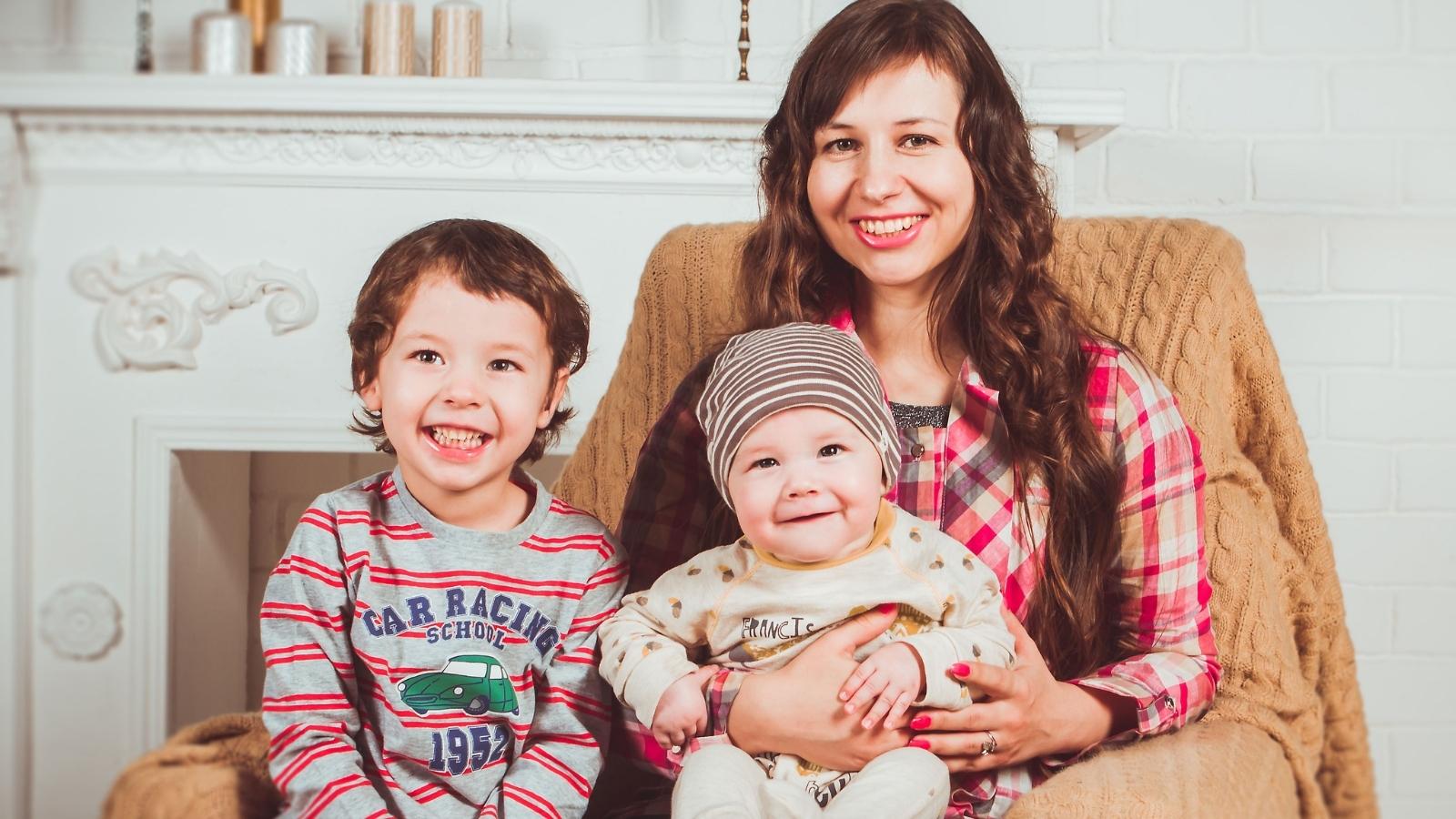 She Planned A Quiet Adults Only Dinner Party For Weeks — Her Friends Last Minute Request To Bring Kids Sparked A Fight mom sitting with her kids