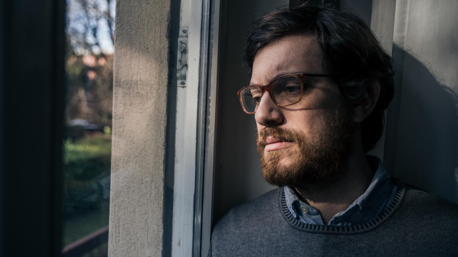 He Sold His House to Escape an Intolerable Neighbor—Only to Have His New Sanctuary Shattered by 6:00 AM Illegal Heavy Equipment Operations man looking out a window