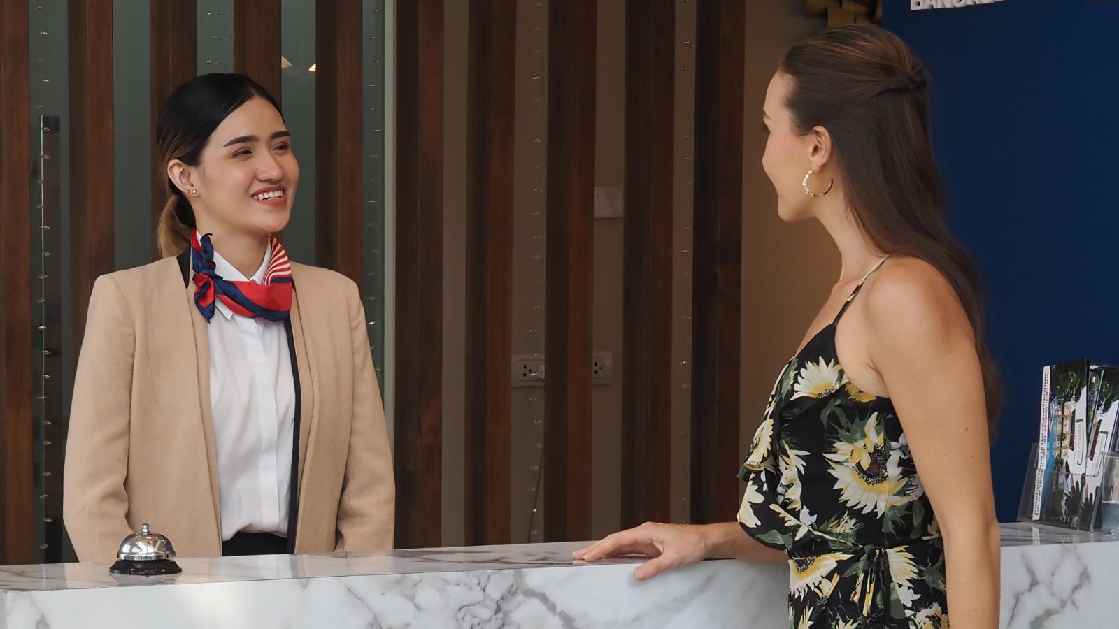 hotel worker with a guest