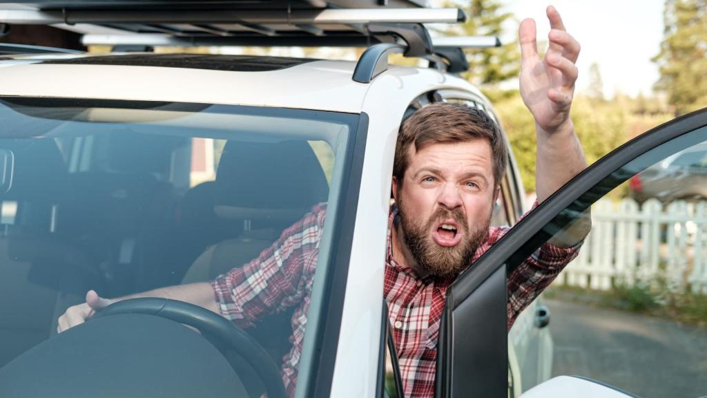 man yelling from a car