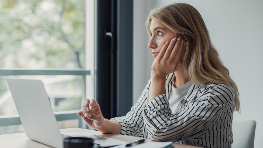 woman looking out a window