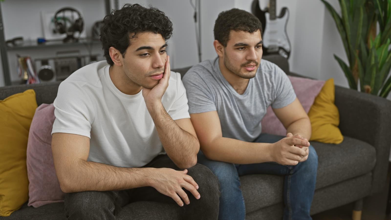 He Hosted His Brother and Sister in Law for Two Weeks—Six Months Later, He Handed Them a Formal 30 Day Notice Over Breakfast two men sitting on a couch