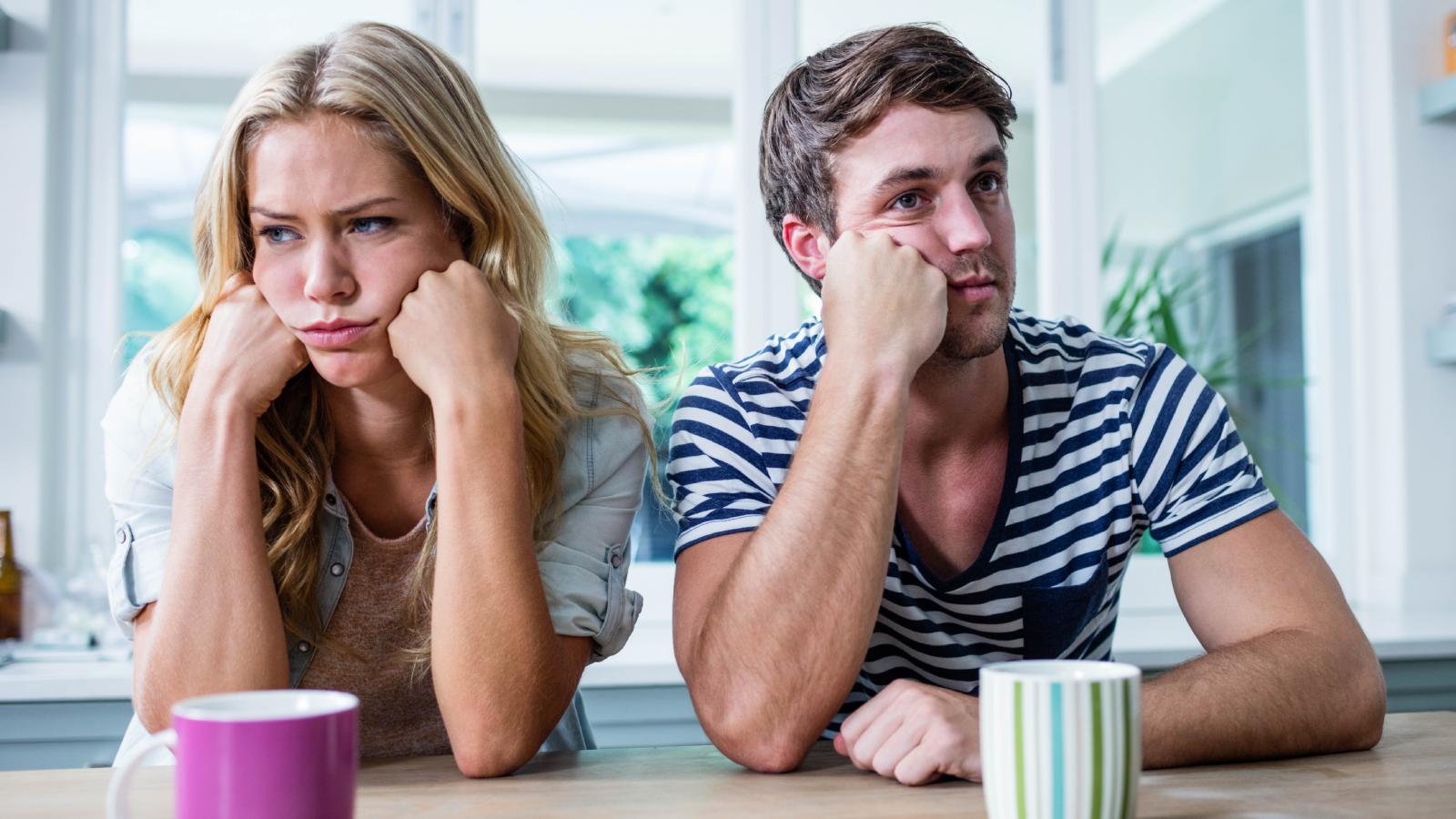 couple in deep thought at a table