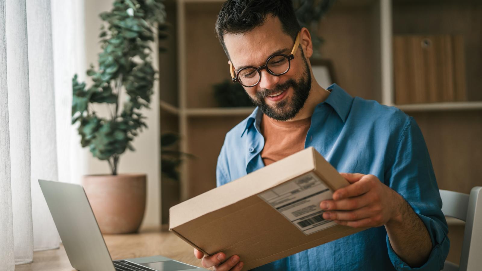 He Wanted to Cancel an Order for Free Shipping — The Company Said No. So He Made Them Pay for the Return Instead man holding a package
