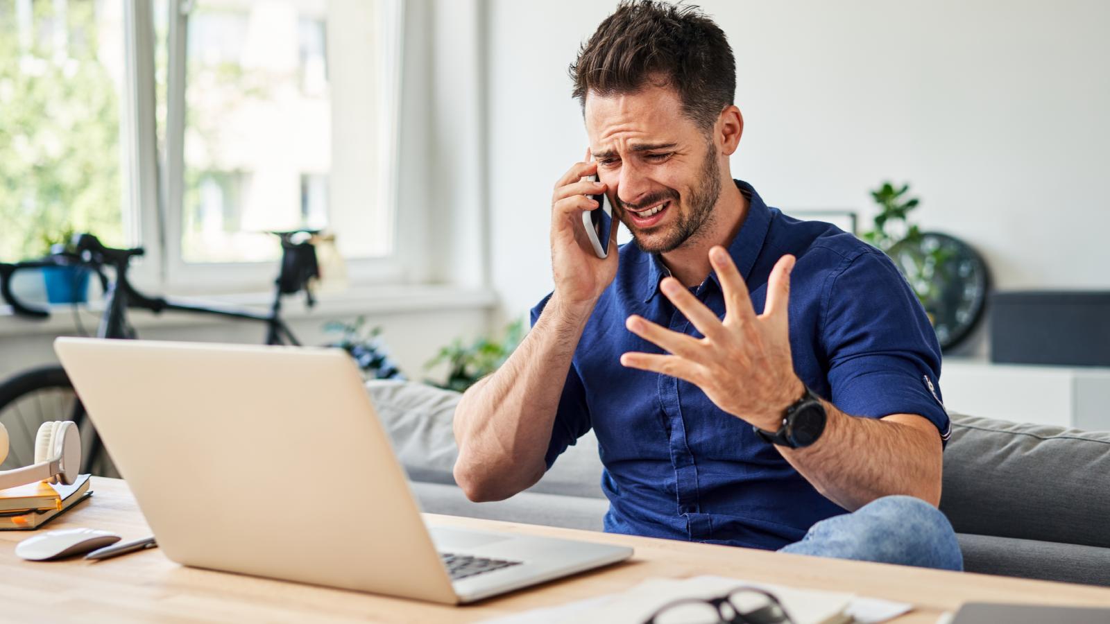 A Boss Demanded He Pay $60 Out of Pocket for a Background Check—Then Axed Him Before His First Day Even Started man on a phone call